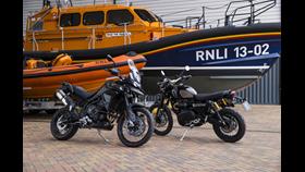 Daniel Craig's motorbikes in front of a Shannon class lifeboat and an Atlantic 85 lifeboat