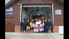 Cat Mantra stood with crew and volunteers from RNLI Portishead lifeboat station. Left to right Tony Hancorn, Simon Lynn, Paul Weston, Jem Smale, Cat Mantra, Simon Perks, Malcolm Came &amp; Ian (George) Lazenby