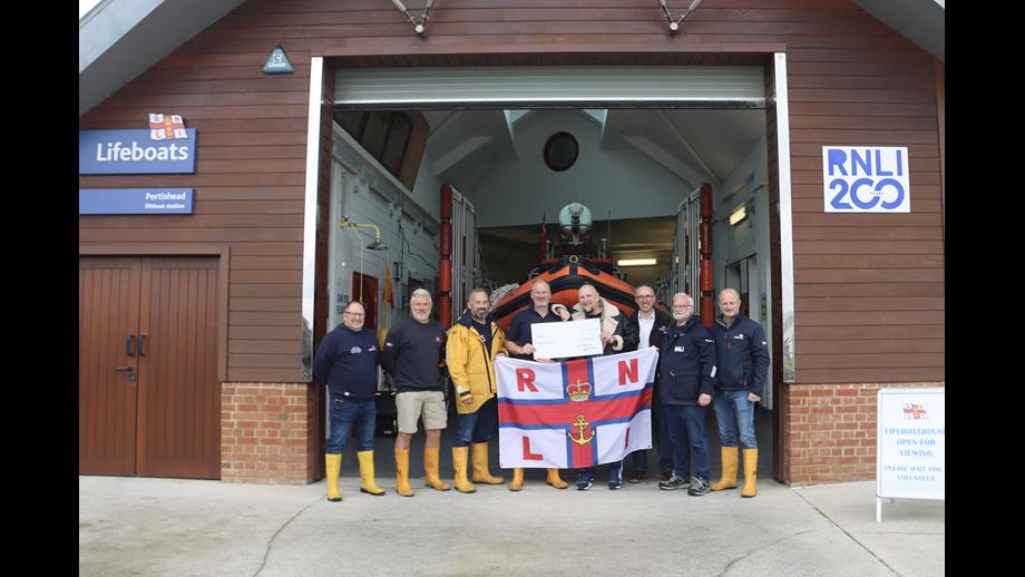Cat Mantra stood with crew and volunteers from RNLI Portishead lifeboat station. Left to right Tony Hancorn, Simon Lynn, Paul Weston, Jem Smale, Cat Mantra, Simon Perks, Malcolm Came &amp; Ian (George) Lazenby