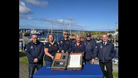 Girvan RNLI volunteers with RNLI 200 Scroll