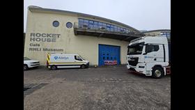 Specialist movers arrive at the RNLI Henry Blogg Museum in Cromer - pictures show work vehicles from the specialist removals firm parked outside the RNLI museum at the Rocket House