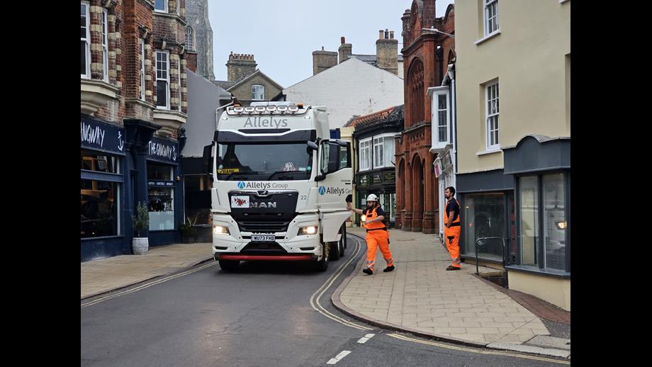 Specialist movers arrive at the RNLI Henry Blogg Museum in Cromer. A low loader is carefully guided through a narrow street in Cromer taking lifting gear and other specialist equipment ready for moving the historic lifeboat