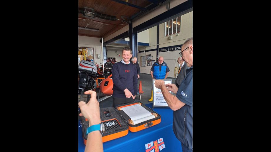 Jim Mayer rep for Crew at Penarth signing the Scroll