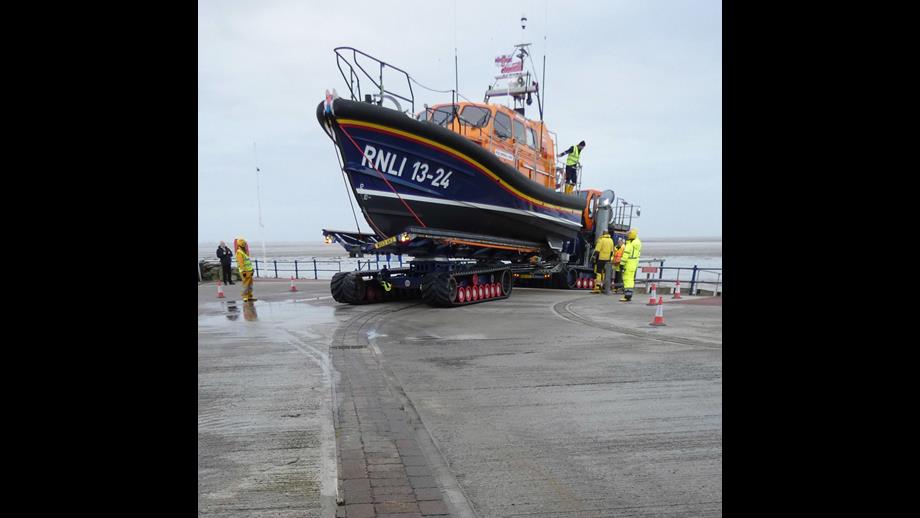 A Lifeboat sits on her carriageover a line of Pavers