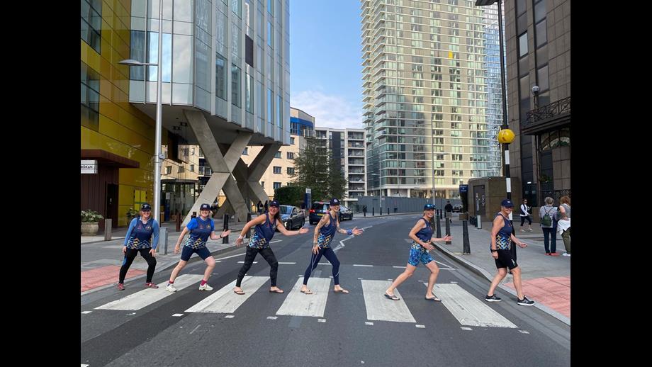 The crew walking across a zebra crossing in London 