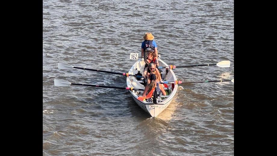 Celtic Longboat being rowed on the Thames