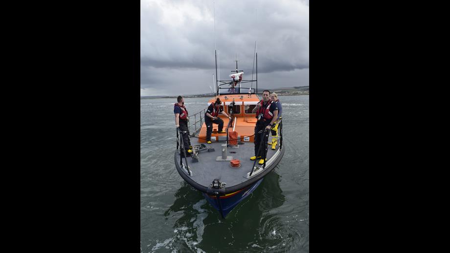 Four crew on boat.