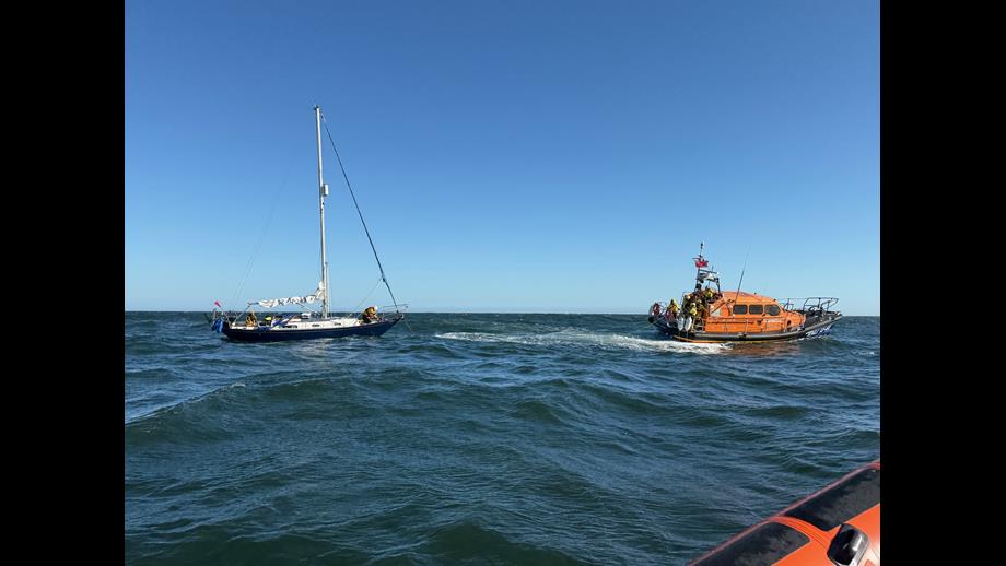 lifeboat towing yacht