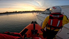 Portaferry RNLI lifeboat alongside the casualty vessel close to Kilclief Beach