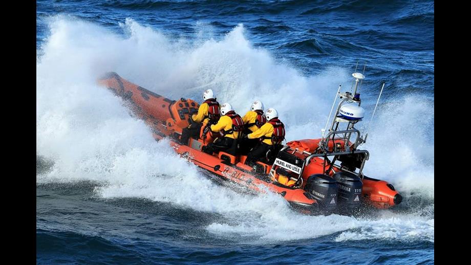 Port Erin's Atlantic 85v lifeboat leaving Peel Harbour