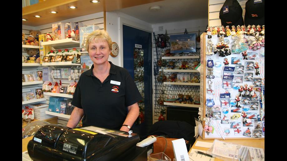Photo of woman in the in RNLI gift shop
