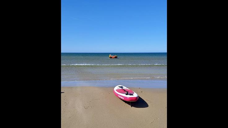 Paddleboard and RNLI crew after rescue