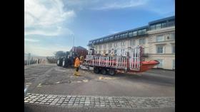 New Brighton boat and shore crew prepare the boat to be launched at the top of the slipway. Tractor can be seen, ready to go, ahead of the carriage.