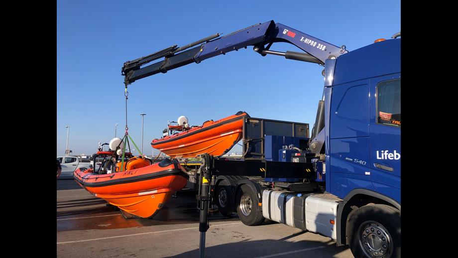 Two B-class lifeboats can be seen to the side of the road transport truck, ready to be swapped over.