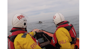 Two men in a boat.
