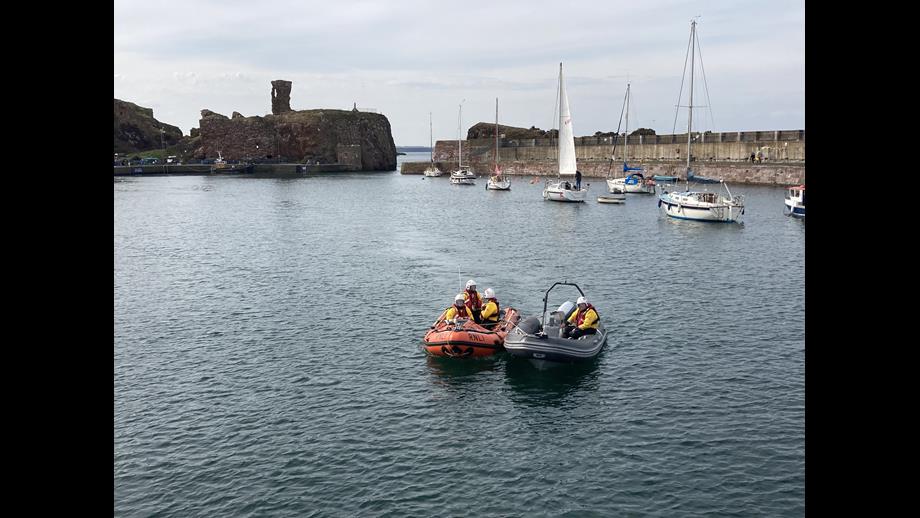 Four men in two boats.