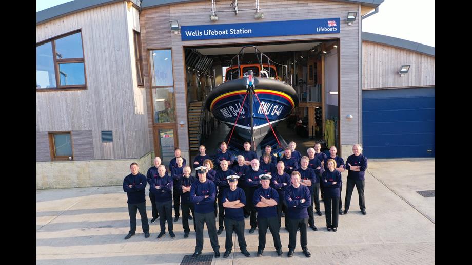 Wells RNLI Lifeboat crew and Shannon class lifeboat 'Duke of Edinburgh' crew photo in front of the boathouse