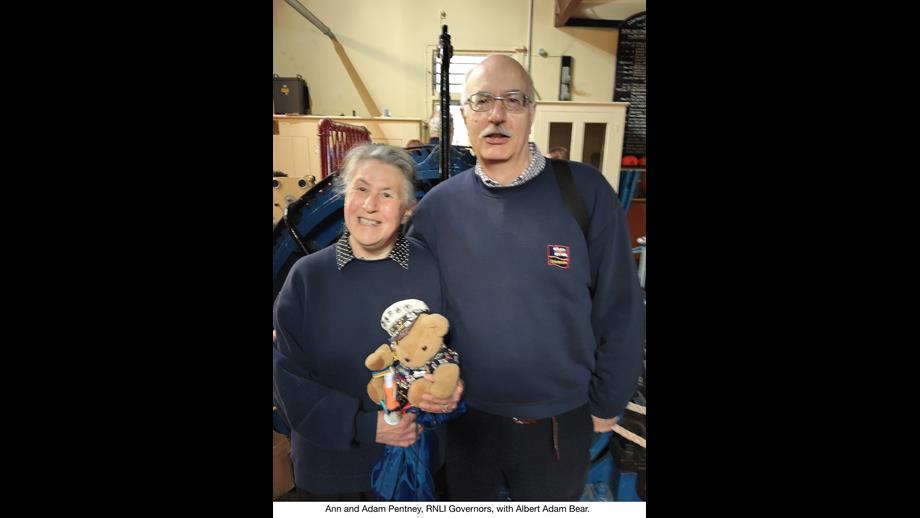Shows two people at Penlee Old Lifeboat Station