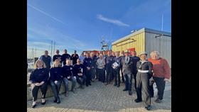 Group photo in front of 17-25 Yarmouth Lifeboat including Lord-Lieutenant Suzie Sheldon and Area Operations Manager Lauren Williams.