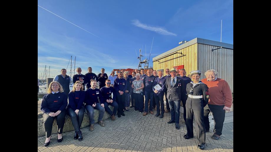 Group photo in front of 17-25 Yarmouth Lifeboat including Lord-Lieutenant Suzie Sheldon and Area Operations Manager Lauren Williams.
