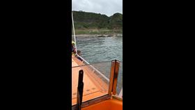 Girvan Lifeboat standing off with our volunteer crew ashore on our daughter craft to extract the casualty