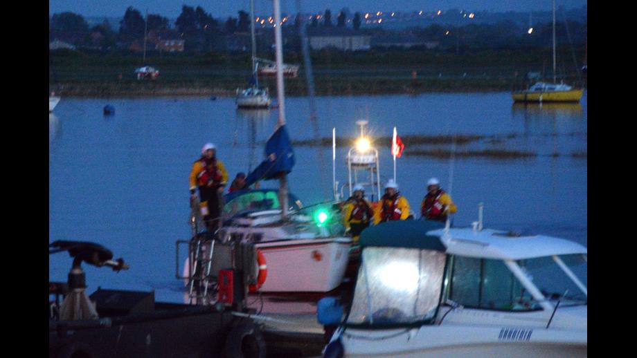 The yacht being moored at the sailing club