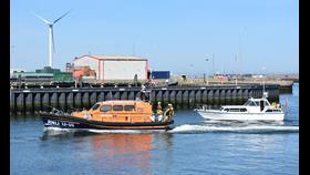 Lowestoft RNLI Lifeboat Patsy Knight escorts the cabin cruiser following an engine fire