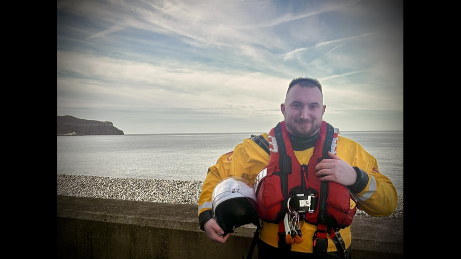 RNLI crew member Calum Darling stood in crew kit.