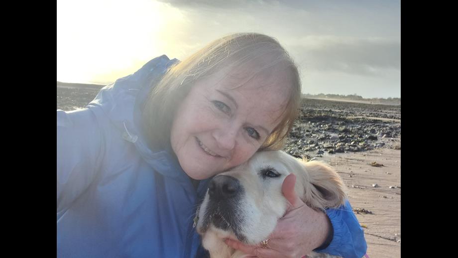Andrea embracing Seren on the beach 