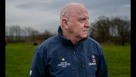 RNLI Moelfre volunteer Phil Williams showing his cochlear implant