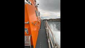 A view of Portree lifeboat making best speed towards the island of Rona.