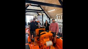 (From L-R) RNLI Helm Phill Woods, Vicki Hau and RNLI Crew Member Sion Flynn stood in the Atlantic 85 inshore lifeboat.