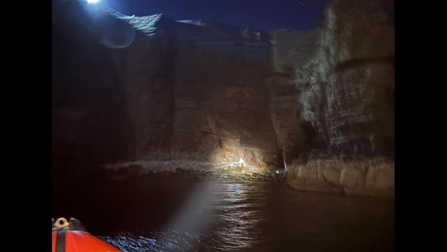 Torch shining from lifeboat to base of cliffs where Vicki fell. 
