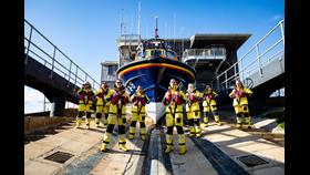 Shoreham Harbour Crew standing on the slipway in front of the all-weather lifeboat
