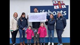 Local musician James Power and his daughters Sophie and Emily present a cheque to Fethard RNLI fundraisers Fiona Barry, Julie Butler, Sarah Bates and Ann Butler fundraiser. Credit RNLI/Fethard Lifeboat Station