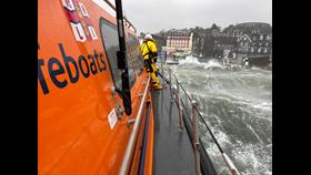 An image taken from the stern of the Shannon class lifeboat showing the heavy seas crashing over the pontoons at Oban's North Pier