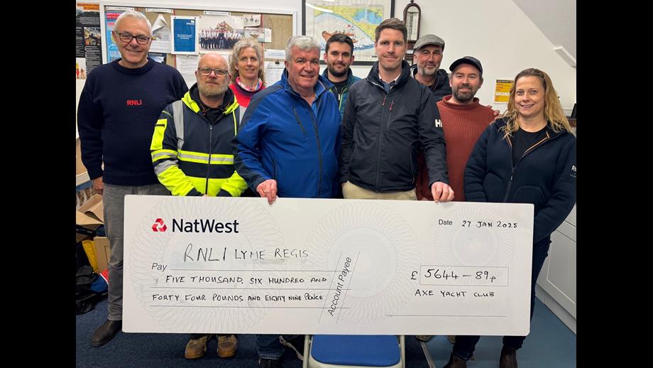 Group of people with large cheque