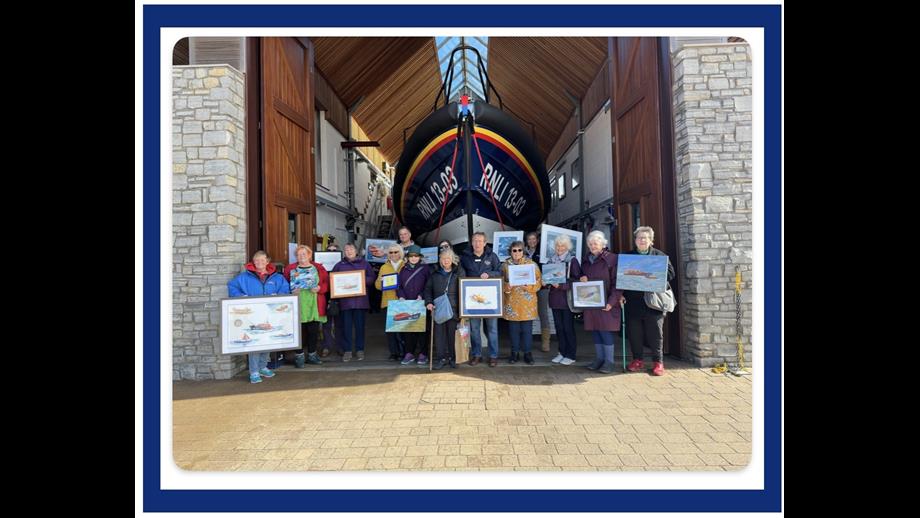 Exmouth RNLI are presented with 24 paintings by Exmouth Art Group to commemorate 200 years of saving lives at sea