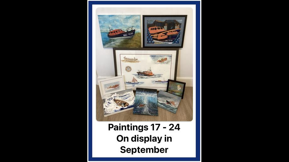 Exmouth RNLI art auction paintings on display in the RNLI shop in September