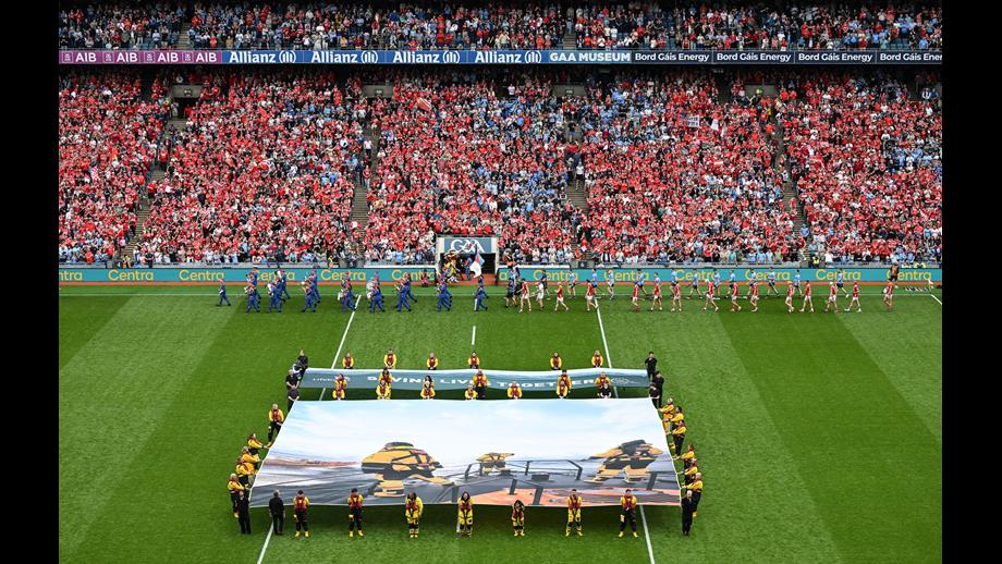 The flags unfurled on the pitch in Coke Park in front of a packed stadium
