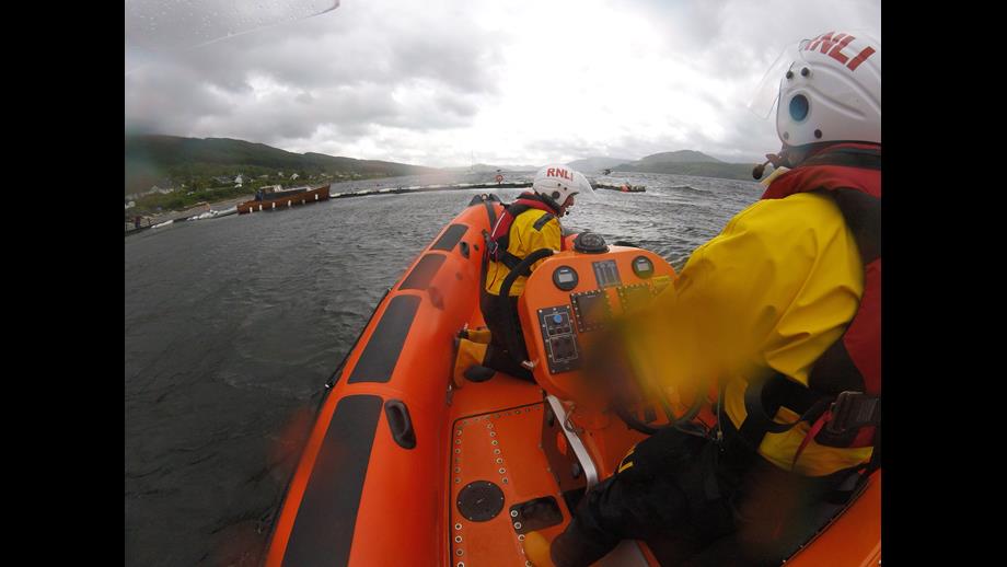 The lifeboat approached the safety of the jetty for casualty drop off