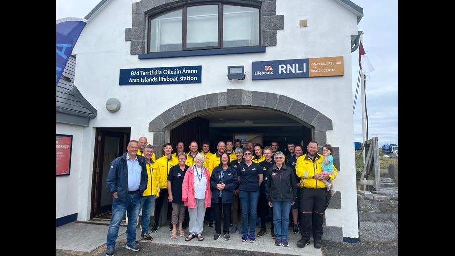 Volunteers and Crew of the Aran islands RNLI standing in front of the station and shop
