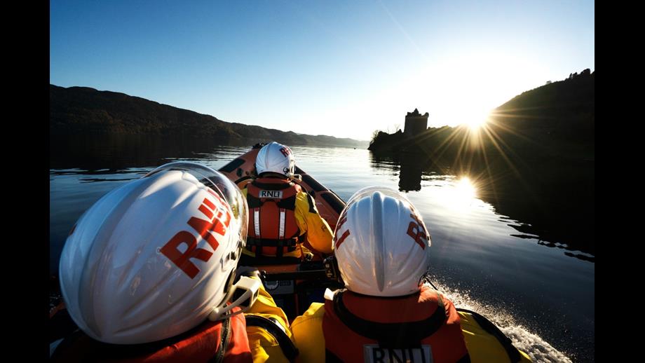 Crew of RNLI Loch Ness approaching Urquhart Castle