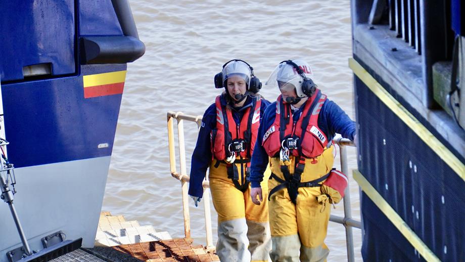 RNLI Demi Trenholm and fellow RNLI volunteer on slipway with Lifeboat beside them