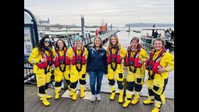 The photo shows 7 RNLI volunteers on the pontoon at Cardiff Bay 