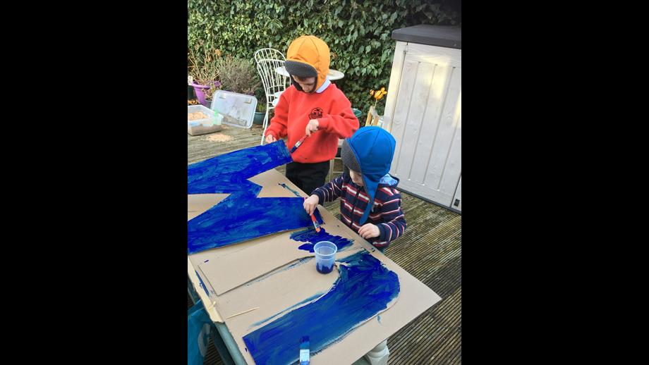 Two boys painting.