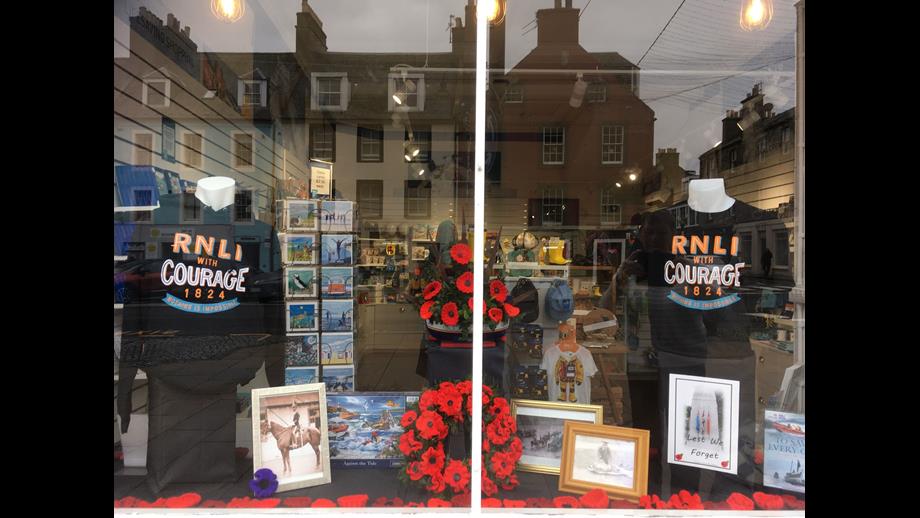 Window display featuring poppies.
