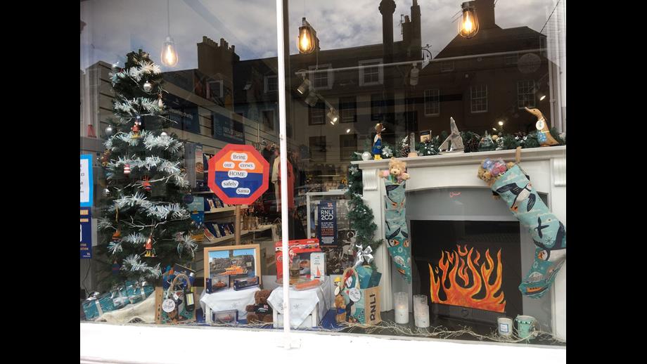 Window featuring a fireplace and tree.