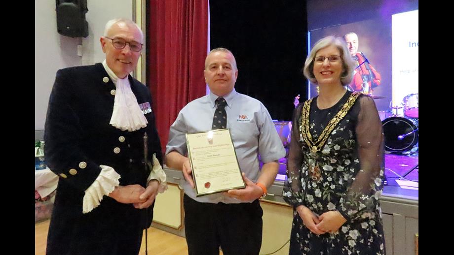 Scot receives his award from Mayor Cllr Sharon Perry and Somerset High Sheriff Rob Beckley