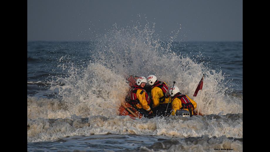Volunteers from Bridlington RNLI heading out to sea on the inshore lifeboat.